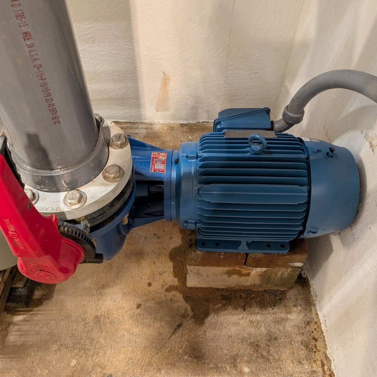 The new pump and motor installed and operating.
