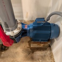 The new pump and motor installed and operating.