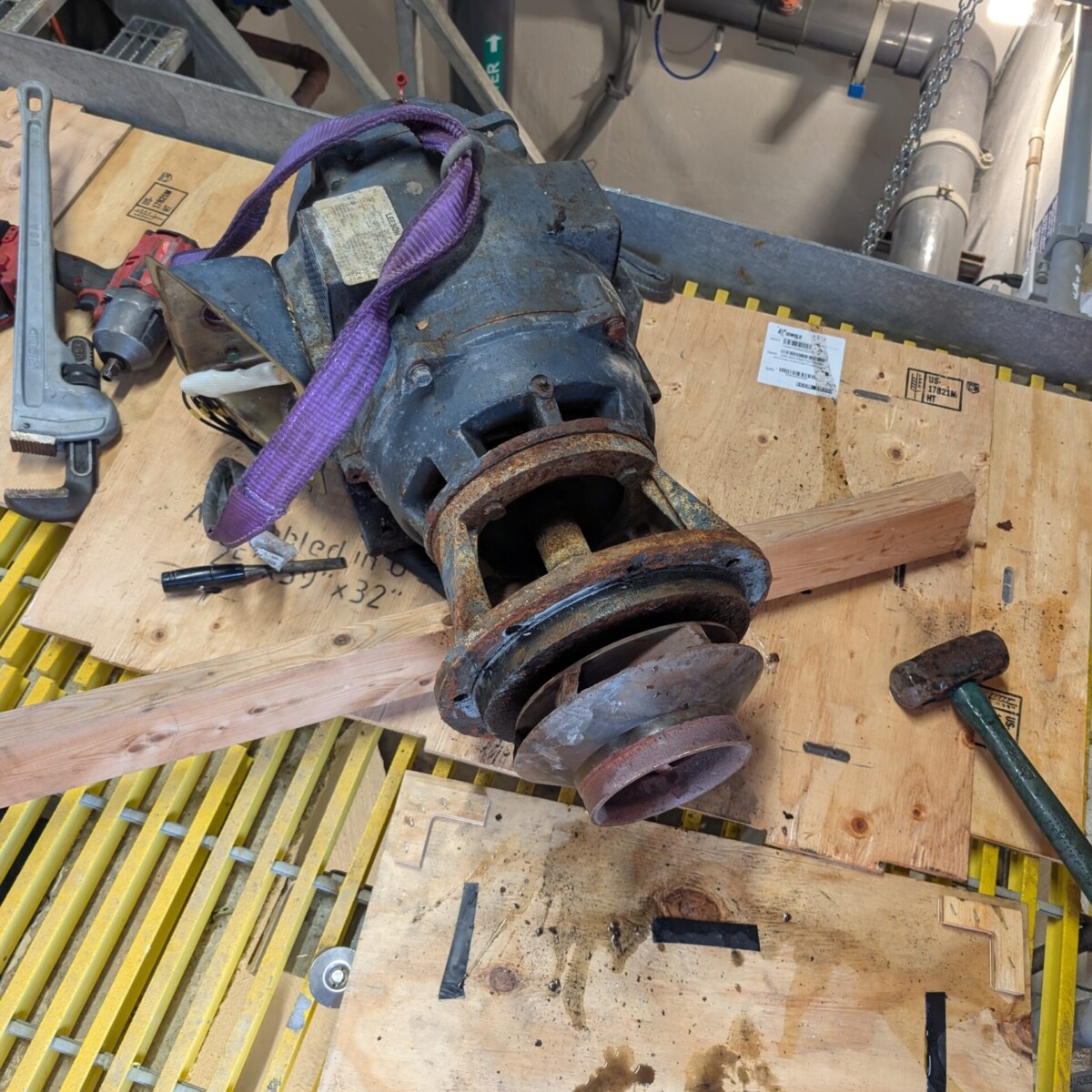 The old motor, after lifting up from the lower level (the pump was already removed).