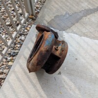 The old pump, located outside of the pump house after removal.