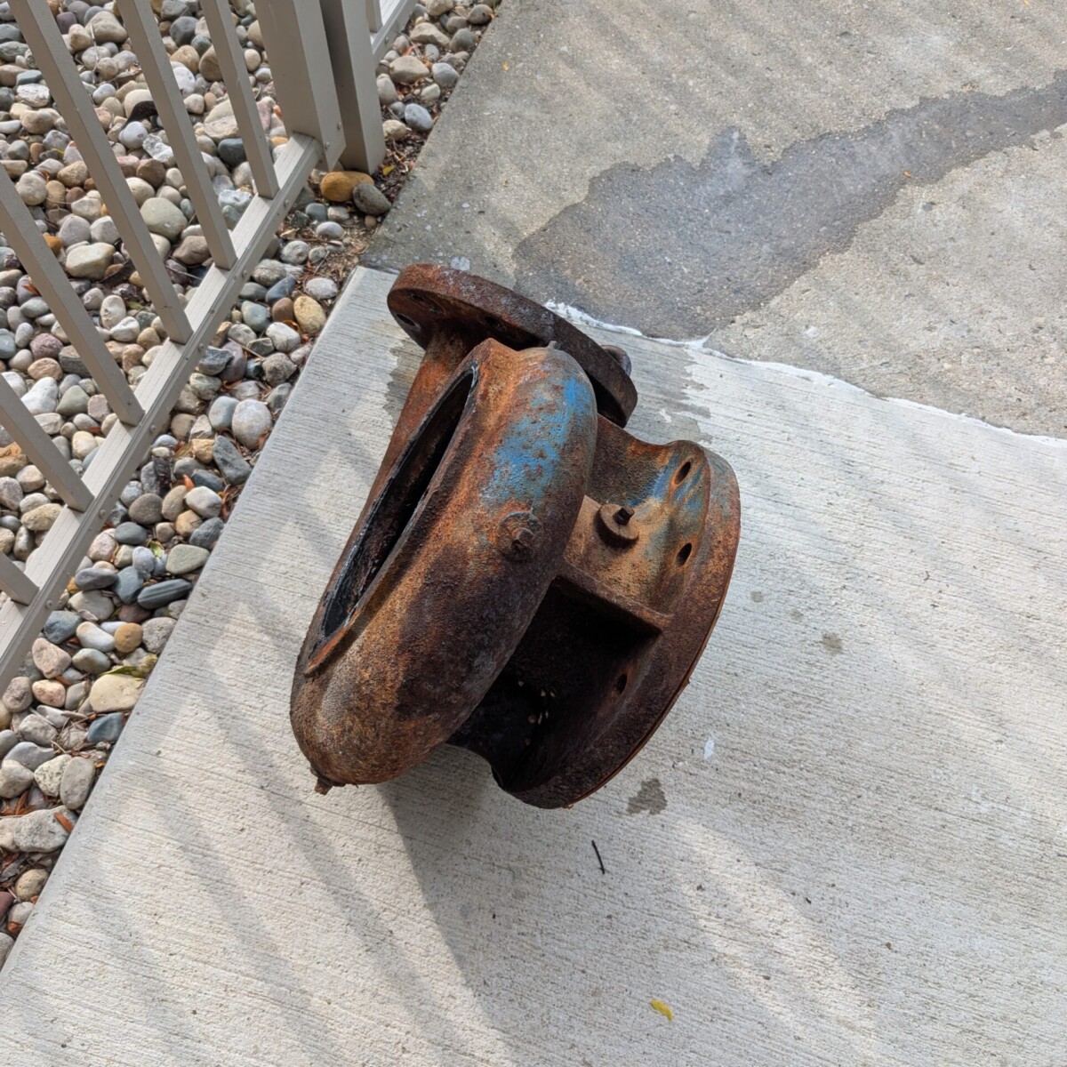 The old pump, located outside of the pump house after removal.