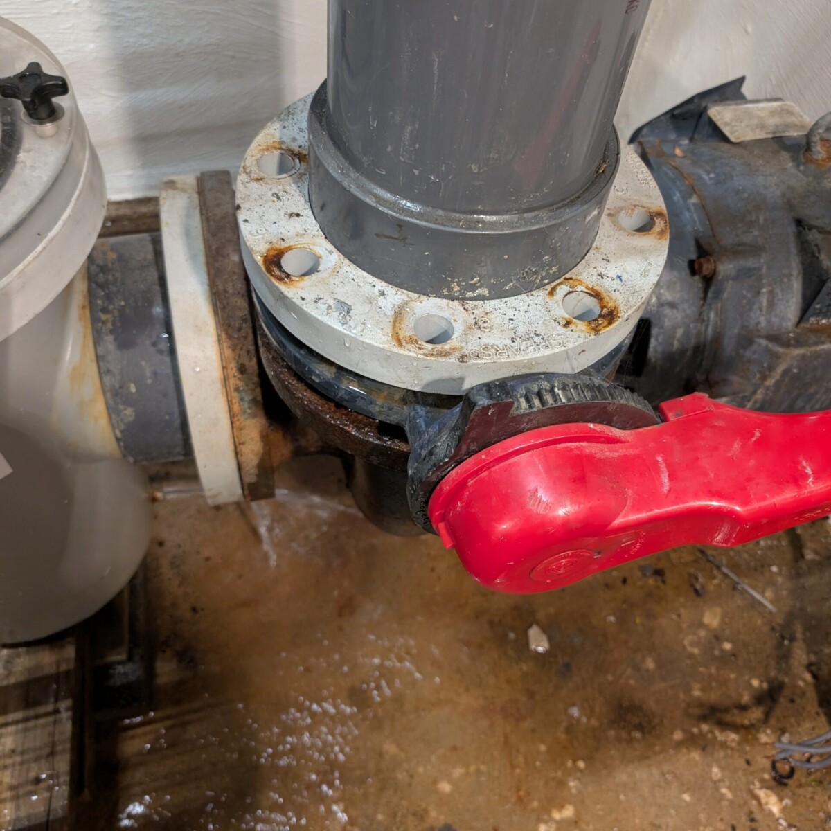 Removing the flange bolts prior to pump removal.
