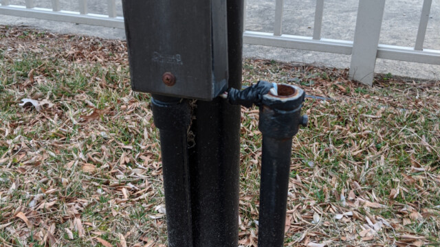 A view of the old wiring in March 2020, near the playground. At the time this photo was taken, the wiring had already been disconnected from an electricity source (no connection in the breaker panel). Old Wiring