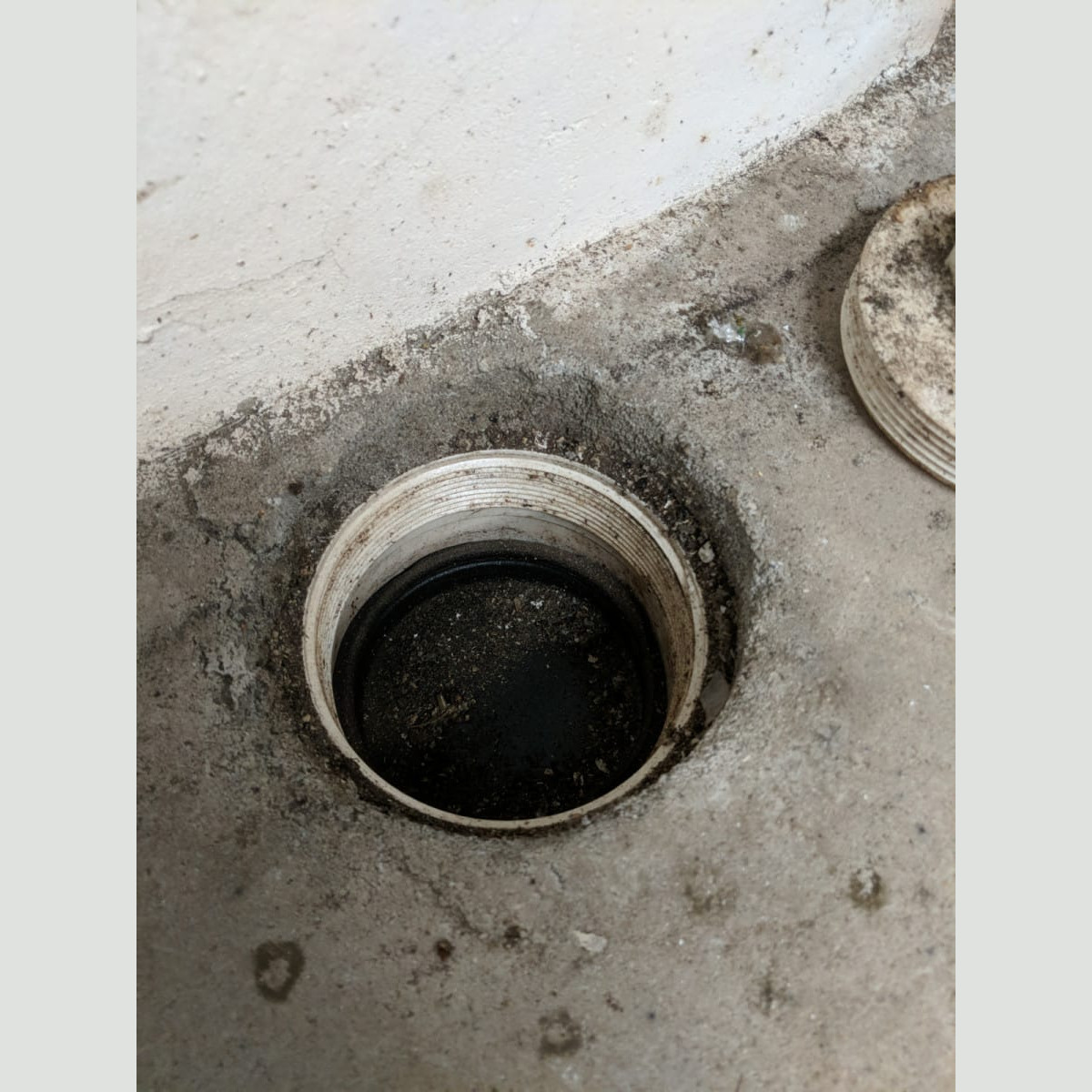 When a clean-out to the "new" internal foundation drain system was opened, it became clear that the system was holding a considerable amount of water. Water in the Foundation Drain in May 2020