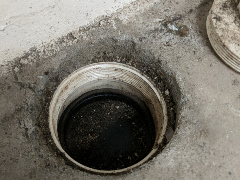 When a clean-out to the "new" internal foundation drain system was opened, it became clear that the system was holding a considerable amount of water. Water in the Foundation Drain in May 2020