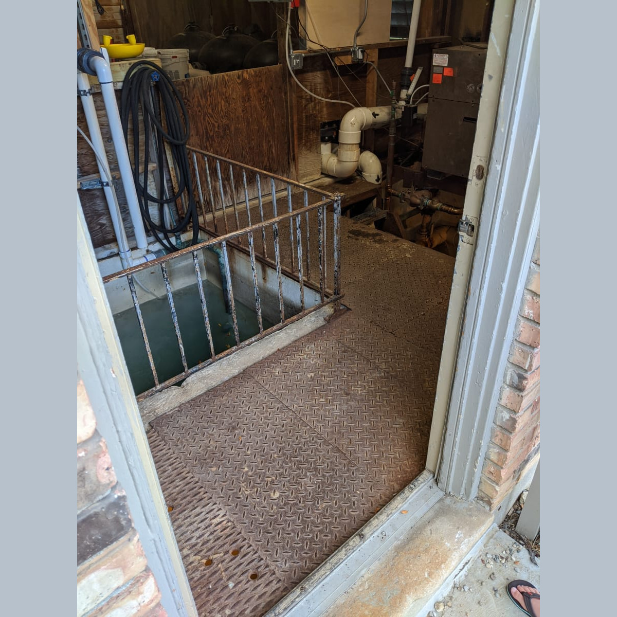 The old floor and railing on July 20th, 2020. Old Floor and Surge Tank Railing