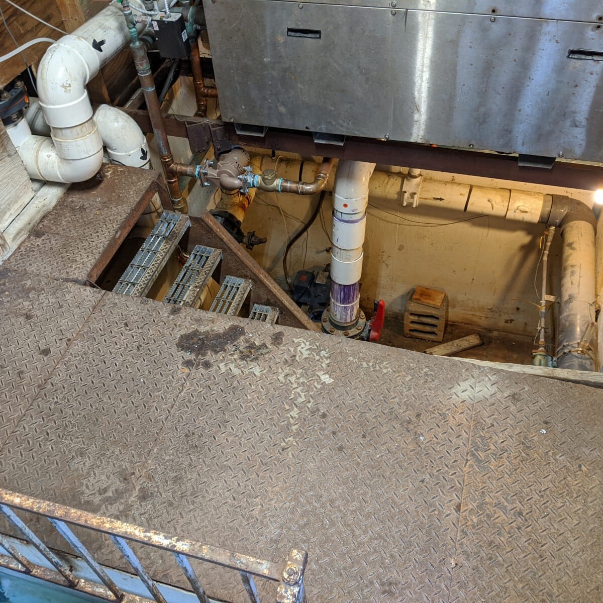 The old floor (note the lack of railing) on July 20th, 2020. Old Floor and Staircase Near Boiler