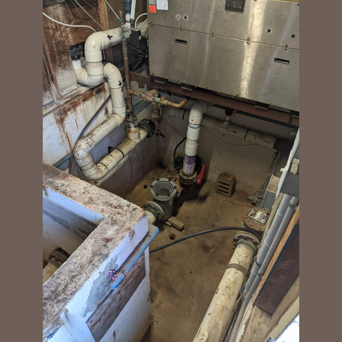 A view of the pump house after removal of the old floor on November 3rd, 2020 (prior to cleanup and removal of old piping). Old Floor Removed (3 of 3)