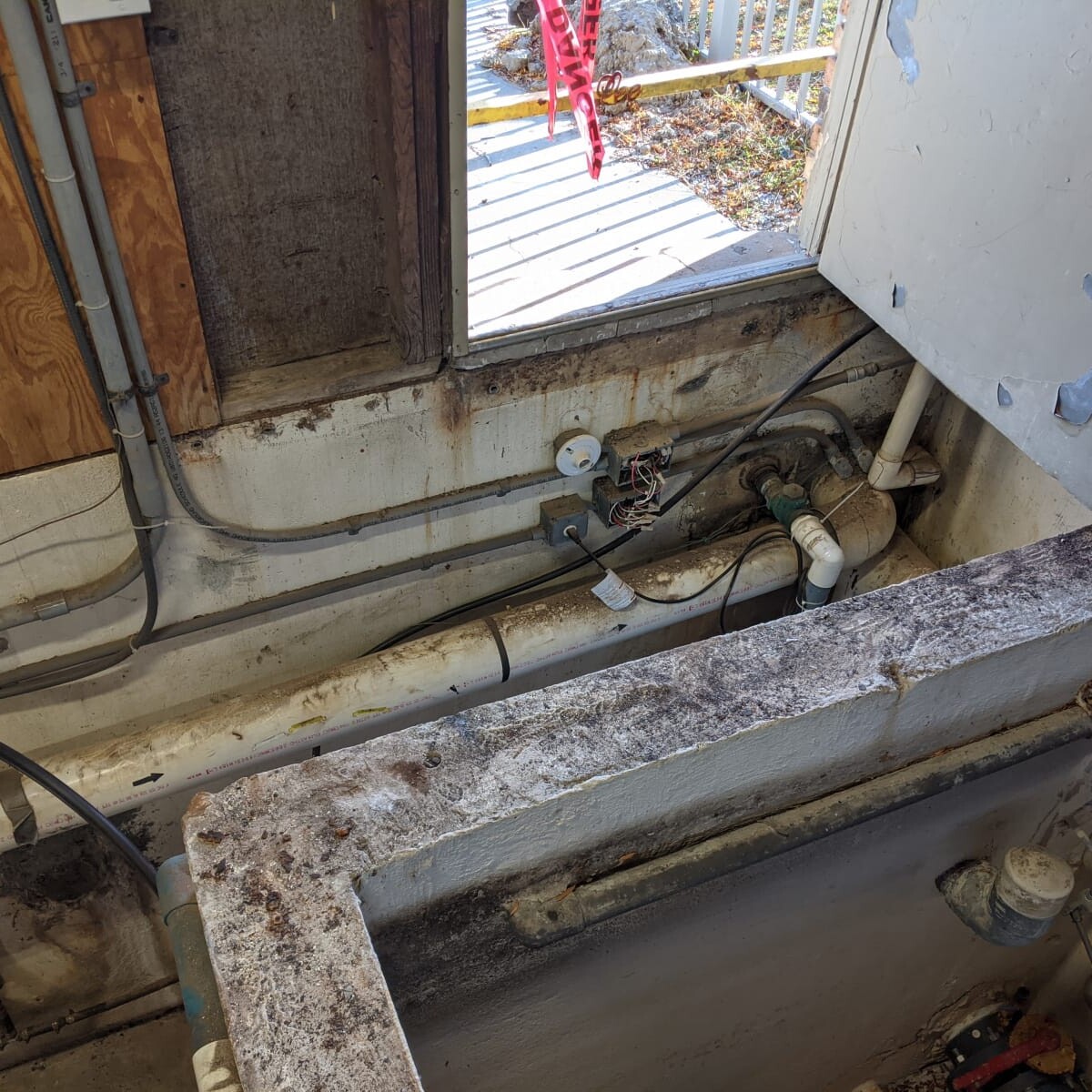 A view of the pump house after removal of the old floor on November 3rd, 2020 (prior to cleanup and removal of old piping). Old Floor Removed (2 of 3)