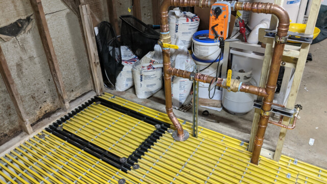 A view of the new access panel into the surge tank (outlined in black) as part of the new floor on January 11th, 2021. New Floor Access Panel