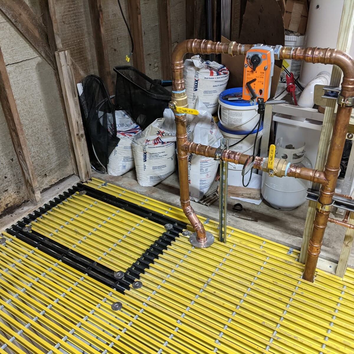 A view of the new access panel into the surge tank (outlined in black) as part of the new floor on January 11th, 2021. New Floor Access Panel