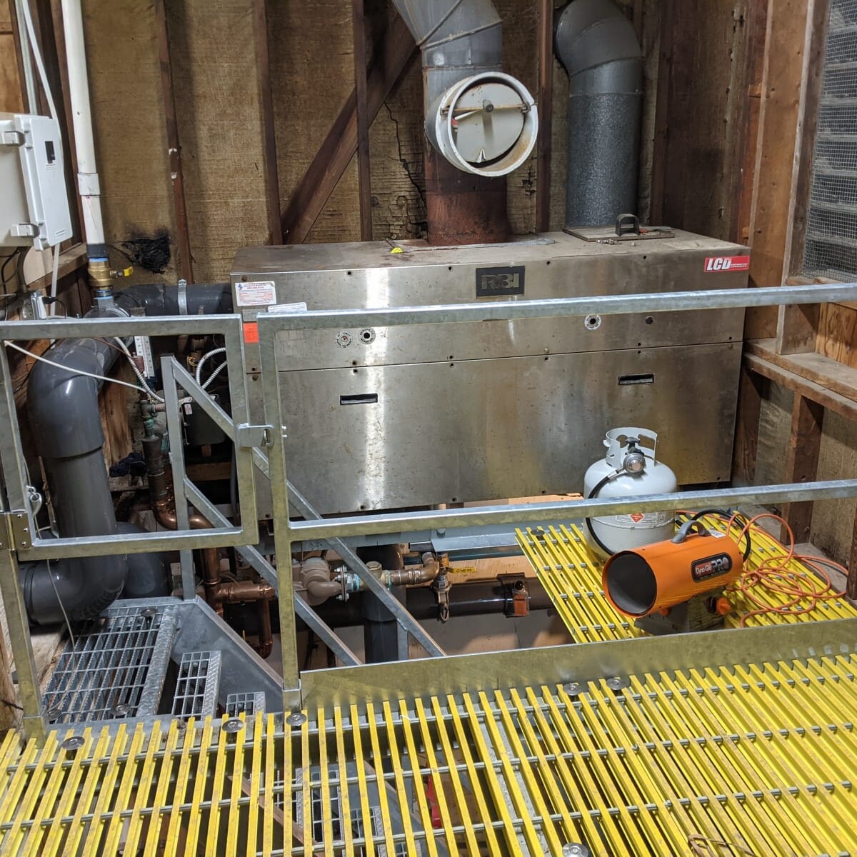 A view of the new railing and floor (the pool boiler in the background) on January 11th, 2021. New Floor and Railing