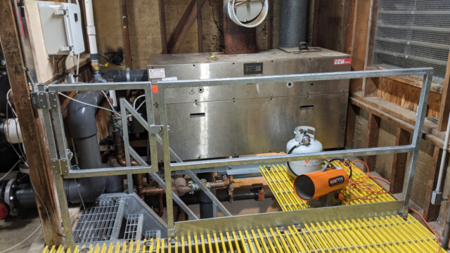 A view of the new railing and floor (the pool boiler in the background) on January 11th, 2021. New Floor and Railing