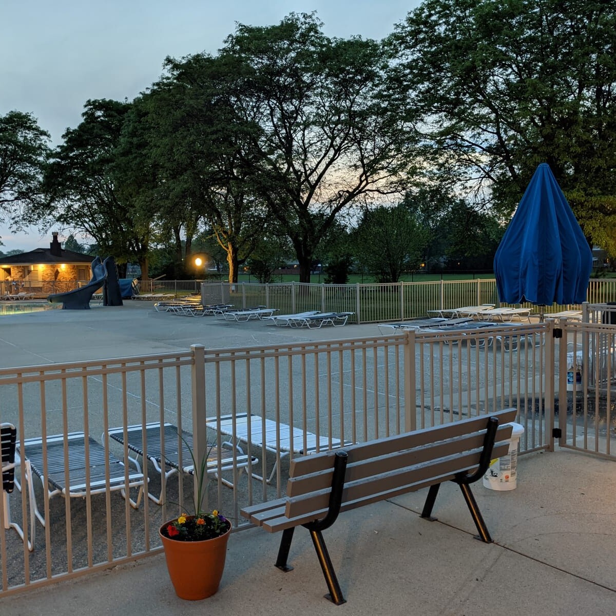 A view of the pool deck at night on May 24th, 2021. The new pump house soffit lights (and a recently painted bench) are also visible in the photo. Pool Deck at Night in May (7 of 7)