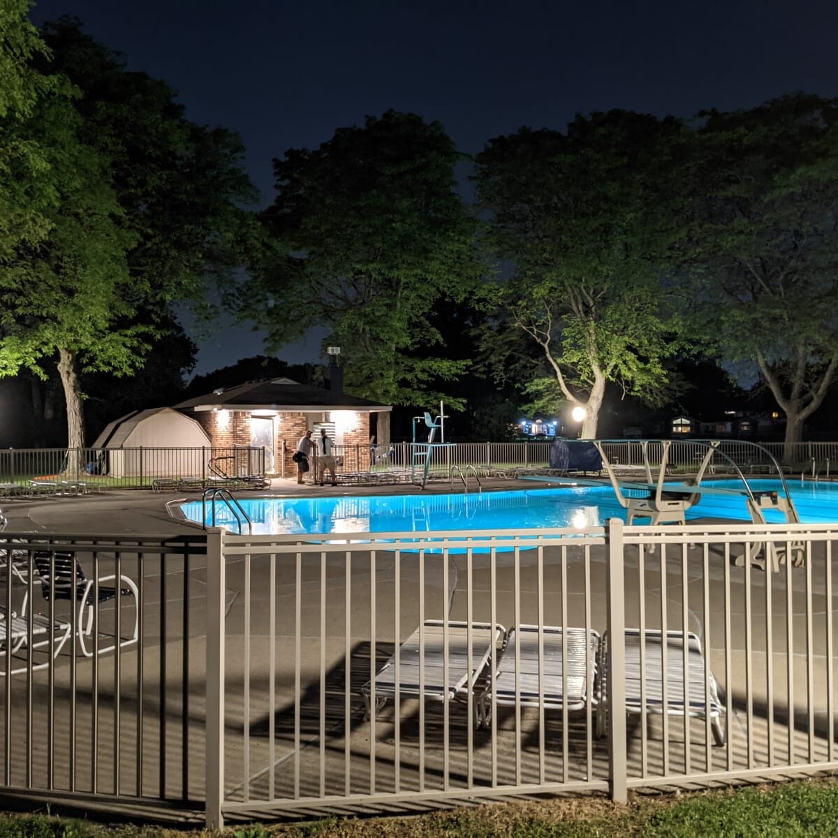 A view of the pool deck at night on May 24th, 2021. The new pump house soffit lights are also visible in the photo. Pool Deck at Night in May (1 of 7)