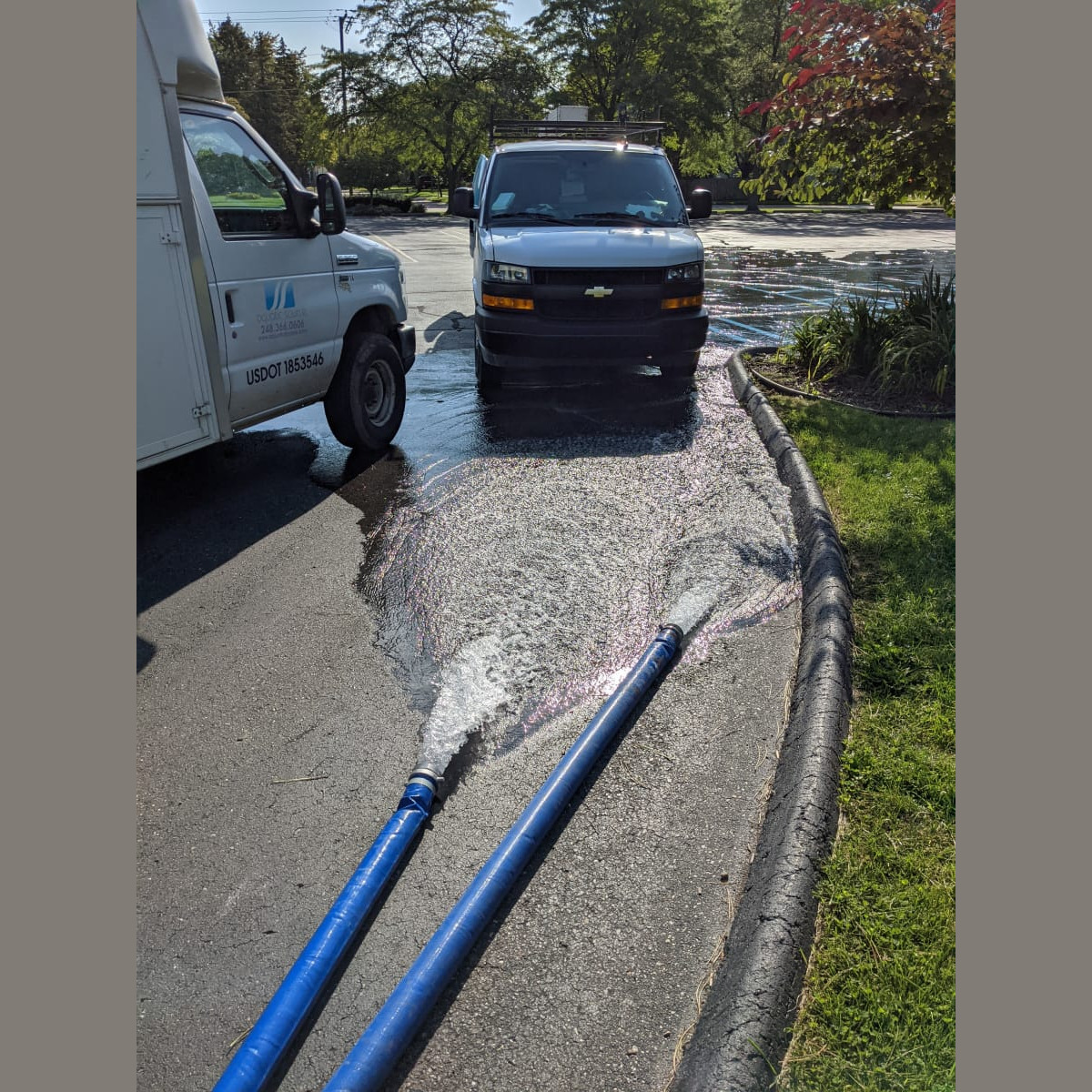 Water is being pumped out into the parking lot. Pumping out Water