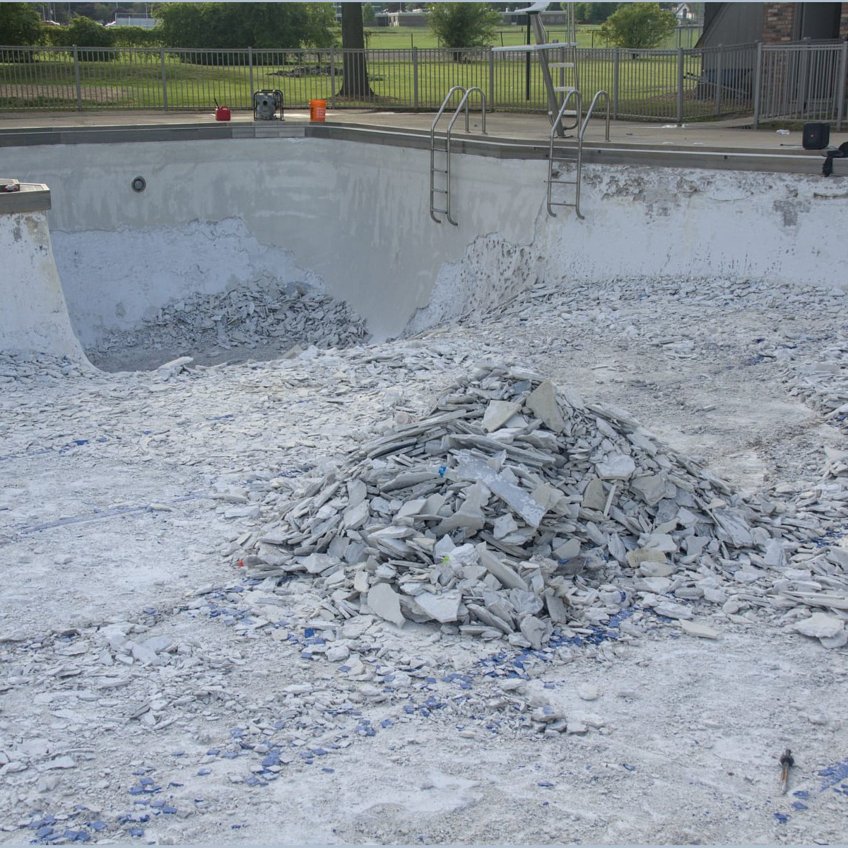 A large pile of debris in the main pool. Demolition - Day 6