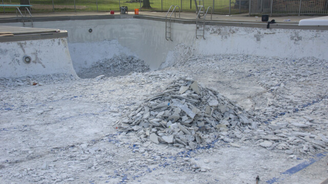 A large pile of debris in the main pool. Demolition - Day 6