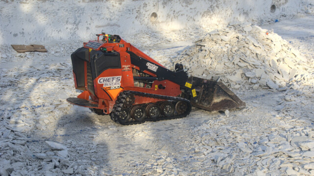 A closer view of the crew's debris loader. Demolition - Day 6